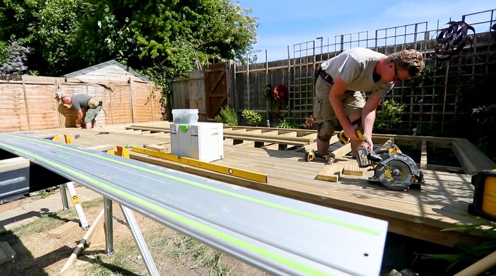 Crew building a timber deck frame